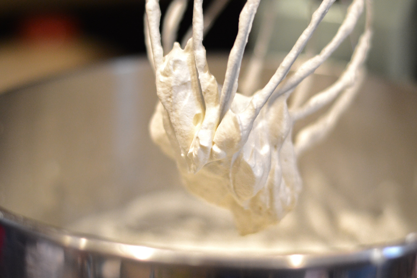 bowl of whip cream in a stand mixer