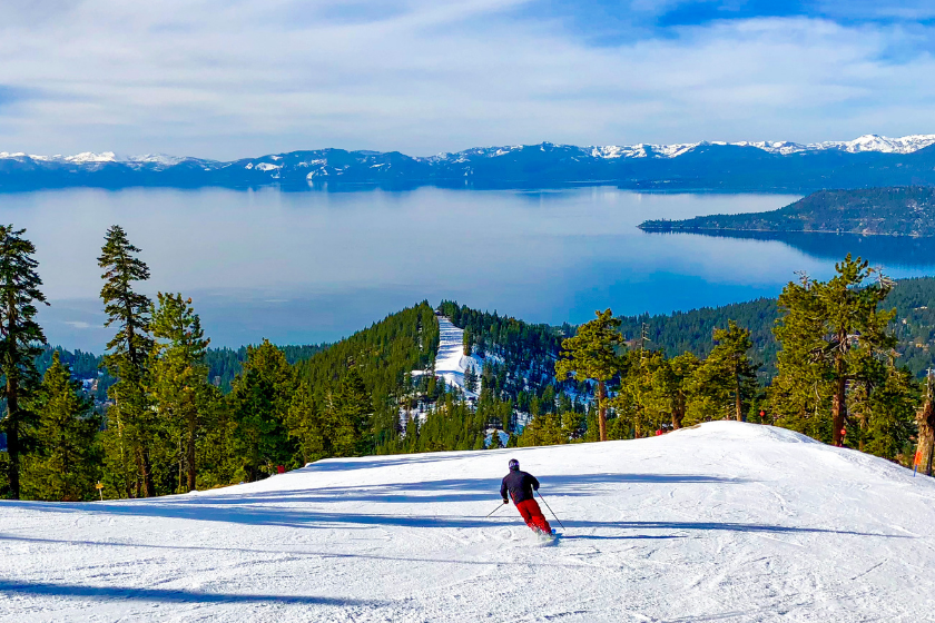 Downhill skiing with Lake Tahoe in the background