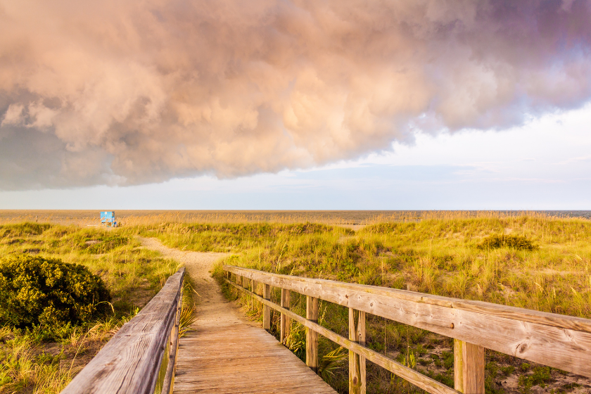Walkway to the Tybee beach during a cloud golden hour.