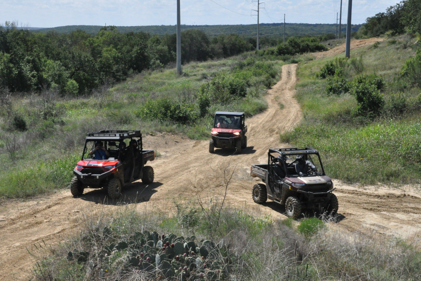 Three Polaris UTVs on the trails in Texas