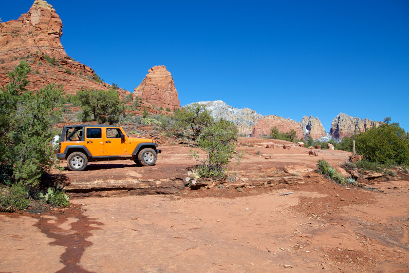 A Jeep off-roading in the Arizona desert.