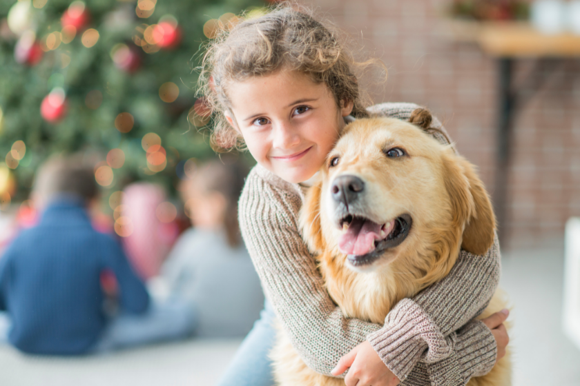 girl hugs dog