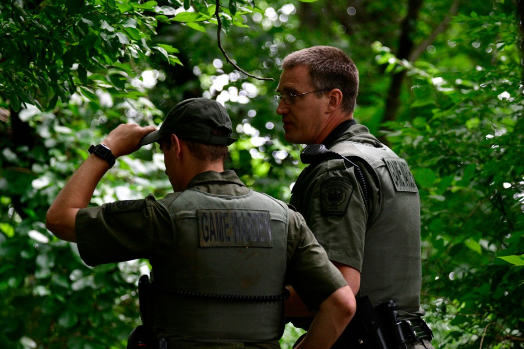 Two game wardens assessing a situation in Pennsylvania.