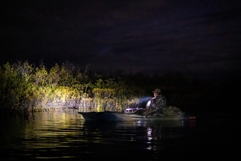 A hunter getting to his spot in a kayak in the pre-dawn hours.