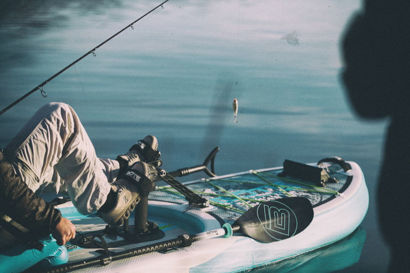 The pedal system of a stand-up fishing paddleboard hybrid. 