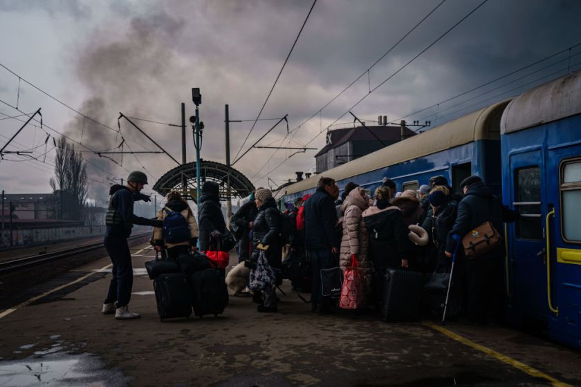 IRPIN, UKRAINE — MARCH 4, 2022: Civilians, mostly women and children rush to board any train car that still has any room on it, as the sounds of battle Ð gunfire and bombing Ð fighting between Russian and Ukrainian forces draw closer to the city of Irpin, Ukraine, Friday, March 4, 2022.