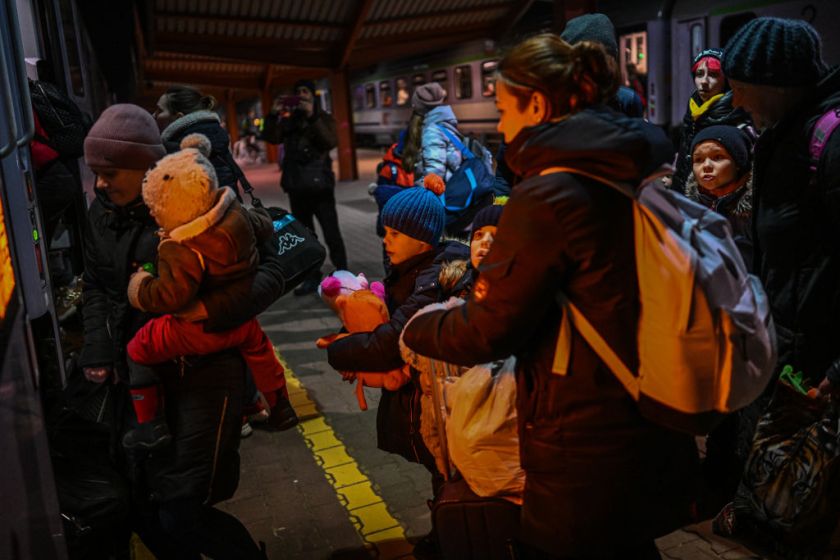 PRZEMYSL, POLAND - MARCH 04: A family with children who fled the war in Ukraine line up to board a train towards Krakow after arriving at the main train station from the Polish Ukrainian border on March 04, 2022 in Przemysl, Poland. Over one million people have left Ukraine since Russia launched its military invasion one week ago. Ukrainian authorities are forbidding men aged between 18 and 60 from leaving and calling on them to fight. Meanwhile Russia is continuing a heavy-handed campaign of attacking major cities such as Kyiv and Kharkiv.