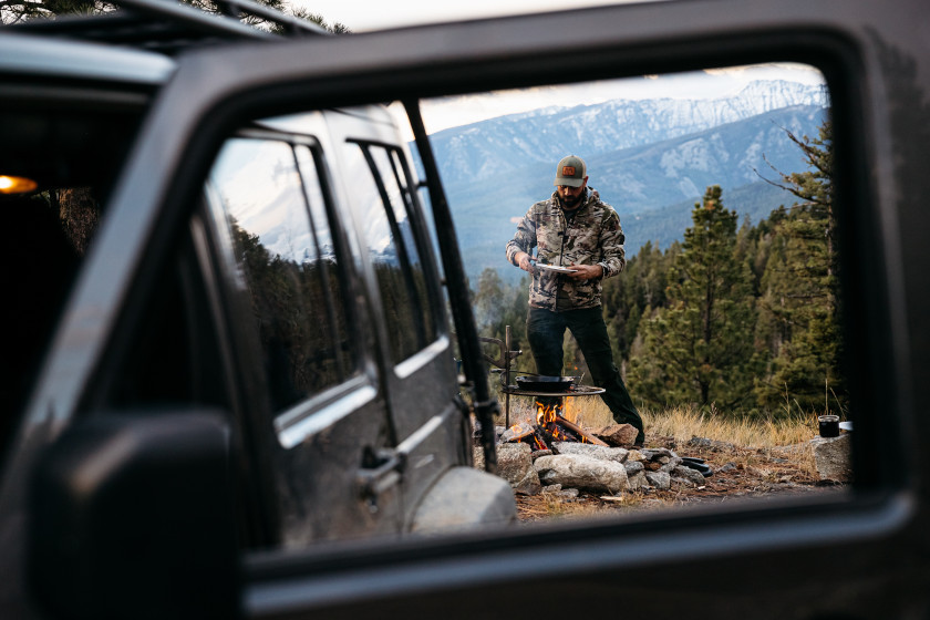 Remi Warren cooking outdoors.