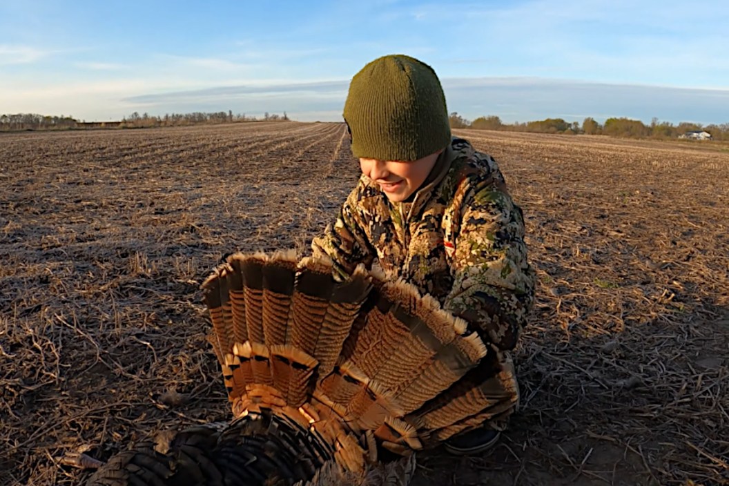A young hunter with his first turkey.