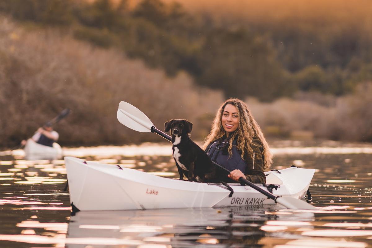 A woman paddling an Oru folding kayak.