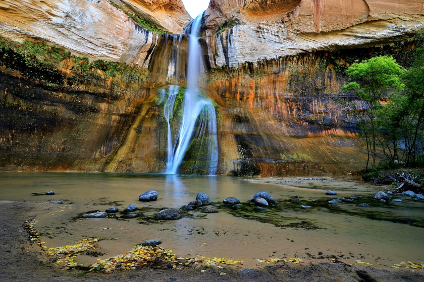 Near Escalante, Utah, Calf Creek pours over a high cliff to a pool below.