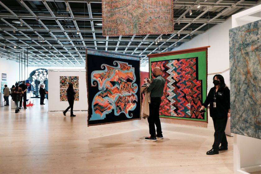 People walk through the Whitney Biennial show at the Whitney Museum of Art on April 06, 2022 in New York City. This year's show, the museum's 80th, is titled "Quiet as It's Kept" and includes over 60 artists. The annual show is considered a survey of the American art scene. Through a variety of mediums, the show explores big tech, borders, the environment, Covid lockdowns and other issues of our time. The Whitney Biennial will be up until September 5, 2022