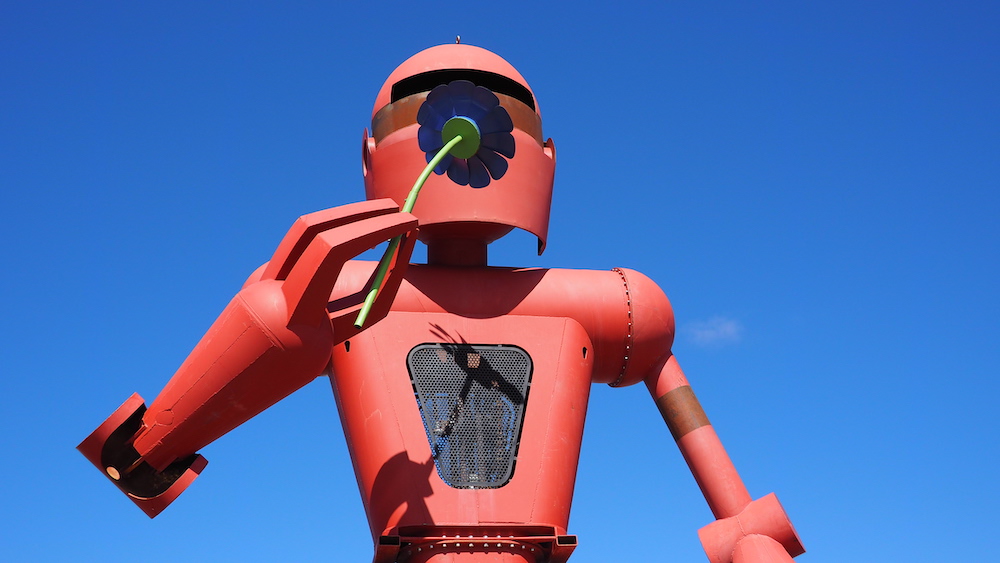 The torso and head of "Becoming Human," Christian Ristow's 30-foot giant robot sculpture, installed in front of the Meow Wolf artist studio in Santa Fe, New Mexico.