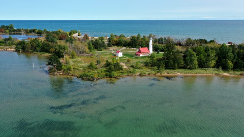 Aerial view of the Tawas Point lighthouse on Lake Huron in Tawas Point State Park.
