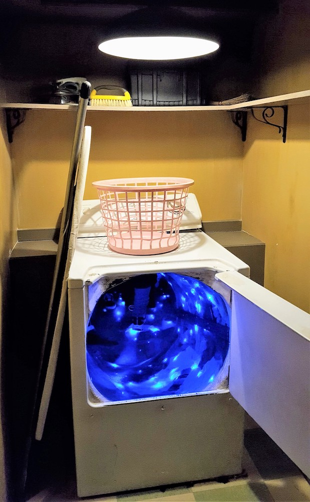a washing machine glows blue inside