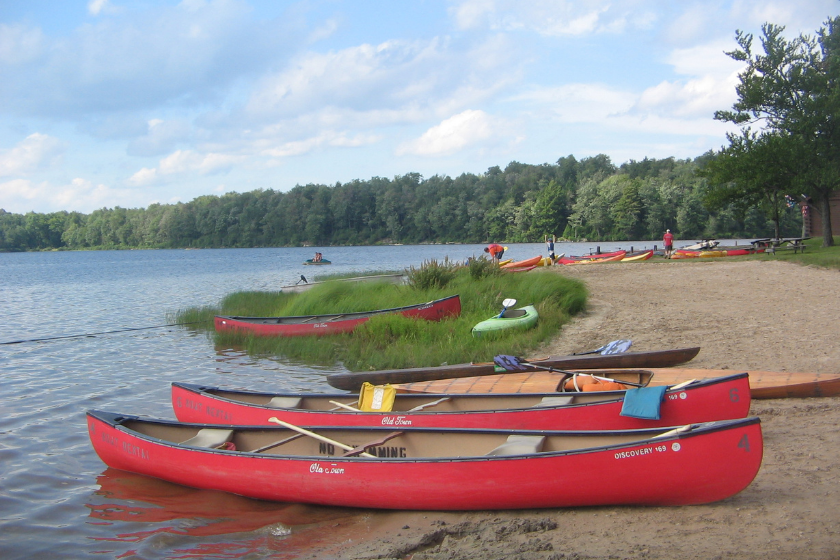 Canoes and other boats at Beach 2 on Lake Jean in Ricketts Glen State Park, Fairmount Township, Luzerne County, Pennsylvania, USA.