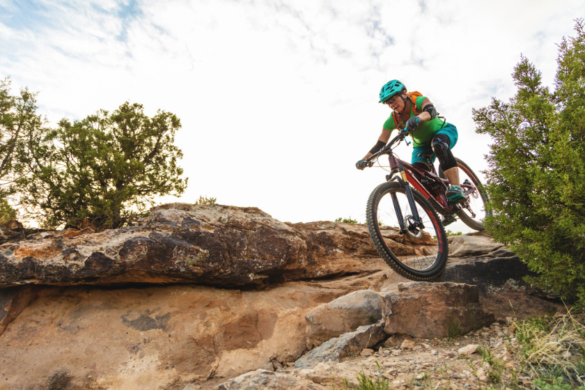 Mountain Biking Adult Female in Western Colorado Desert Arid Climate late Evening