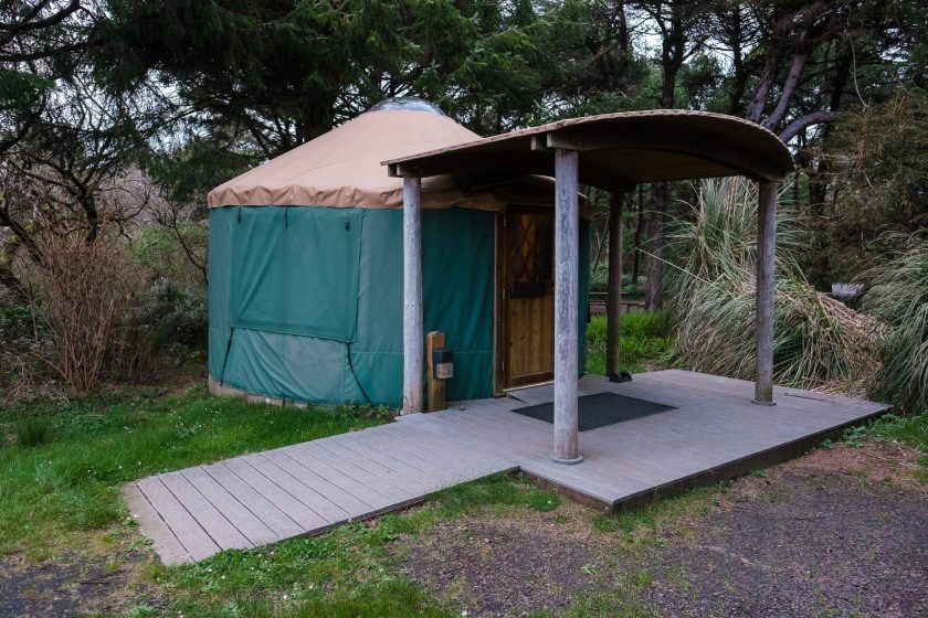 Green camping (or glamping) yurt on the Oregon Coast at a beach campground.