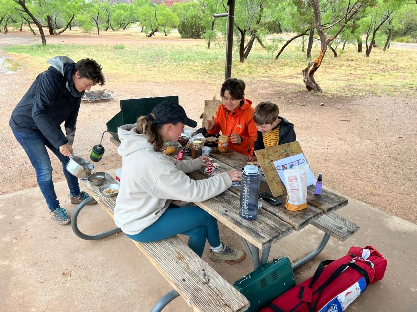 Friends gathering at campsite for food