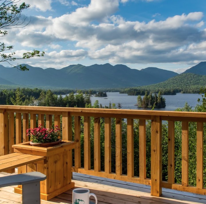 The Big Darling cottage sits atop a wooded hill which provides excellent views of the High Peaks and Elk Lake