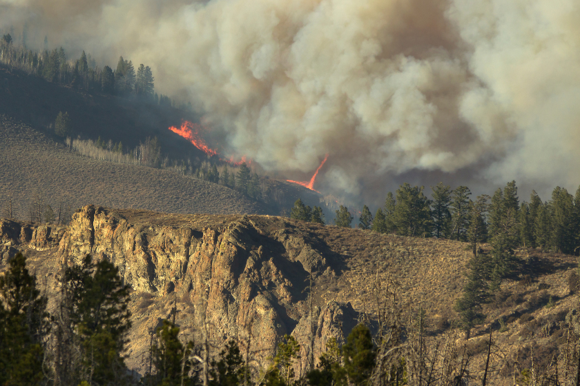 Flames and a fire tornado or fire whirl devour sagebrush and pines in the Arapahoe National Forest and Rocky Mountain National Park in Colorado's second largest wildfire, the East Troublesome Fire burning just outside Hot Sulphur Springs.