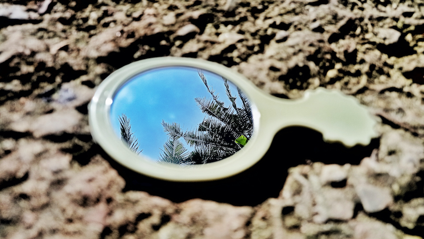 Hand Mirror with Reflection of Blue Sky