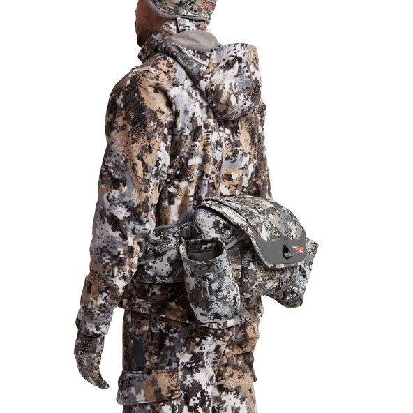 The SITKA Gear Tool Belt worn by a hunter in camo.