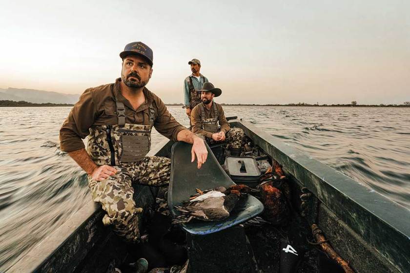 Hunters wearing the new Duck Camp Zip Waders on a duck hunting boat