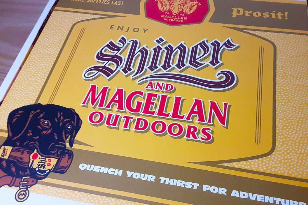 A box with a logo highlighting the Shiner and Magellan Outdoors apparel and gear collaboration