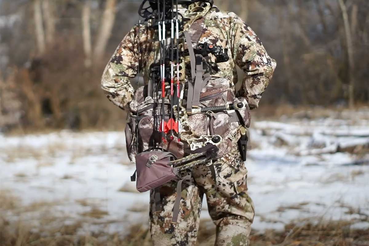 A hunter in camo wearing Cabela's Fanny Pack