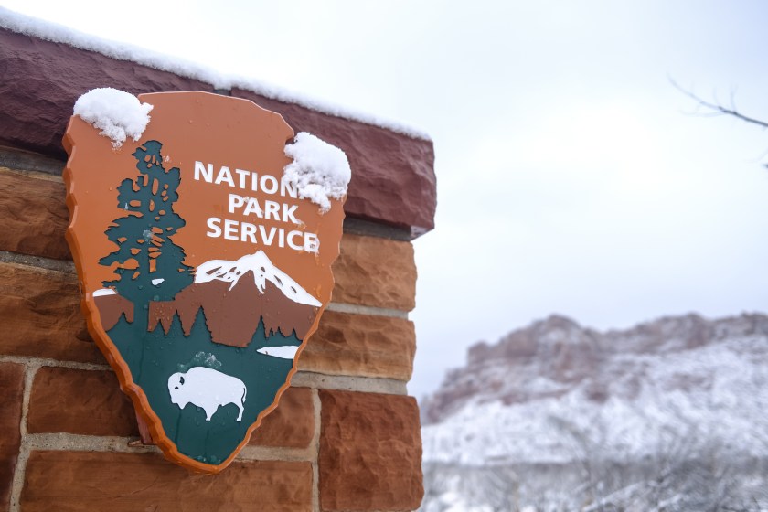 National Park Service sign with snow Zion