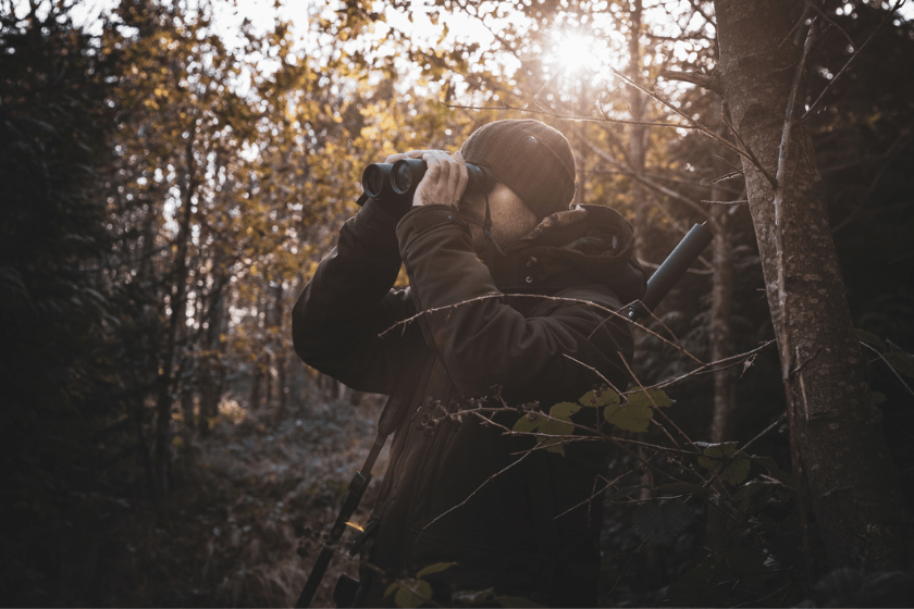 using binoculars to hunt