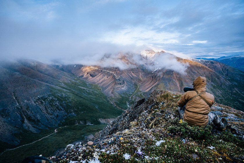 a hunter scouting for elk or deer on a mountaintop