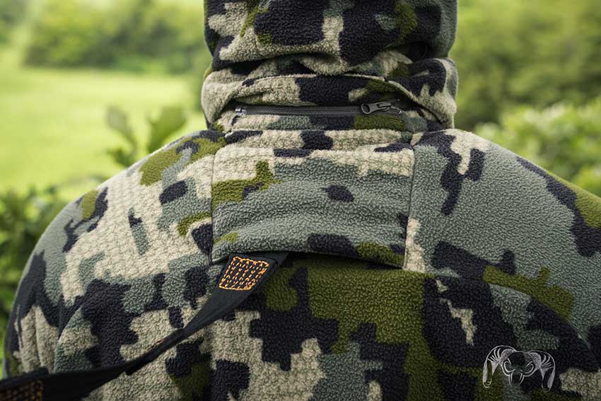 The back of a hunter sitting in a tree wearing the new KUIU Proximity apparel line.