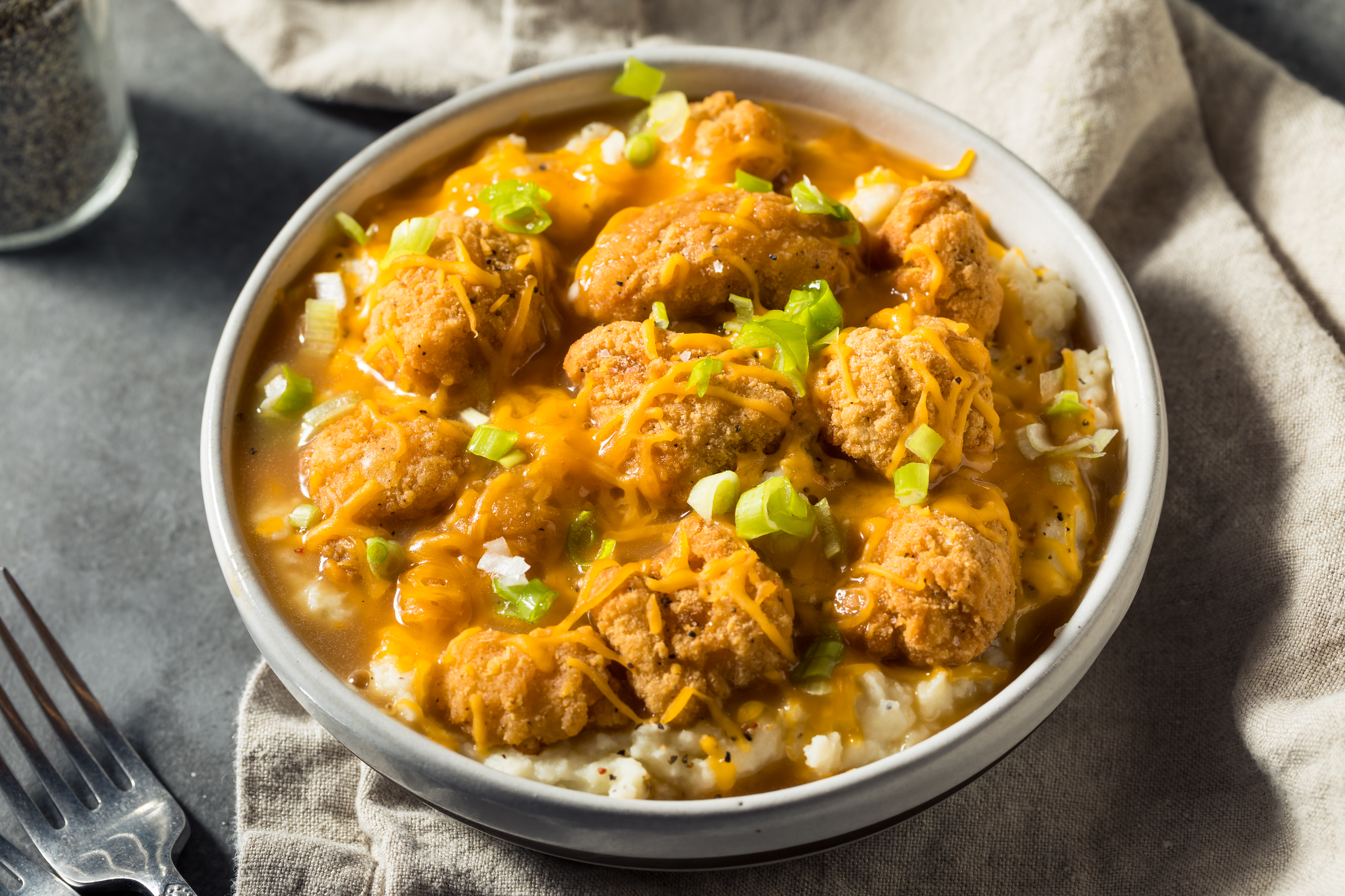 Homemade Fried Chicken Mashed Potato Bowl with Cheese and Gravy