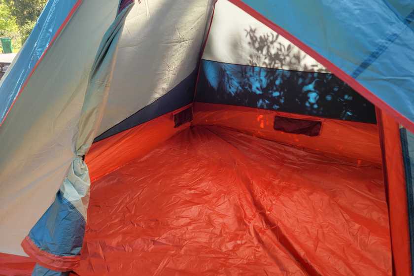 Kelty Discovery Basecamp 6 interior with mesh pockets on all sides of the tent