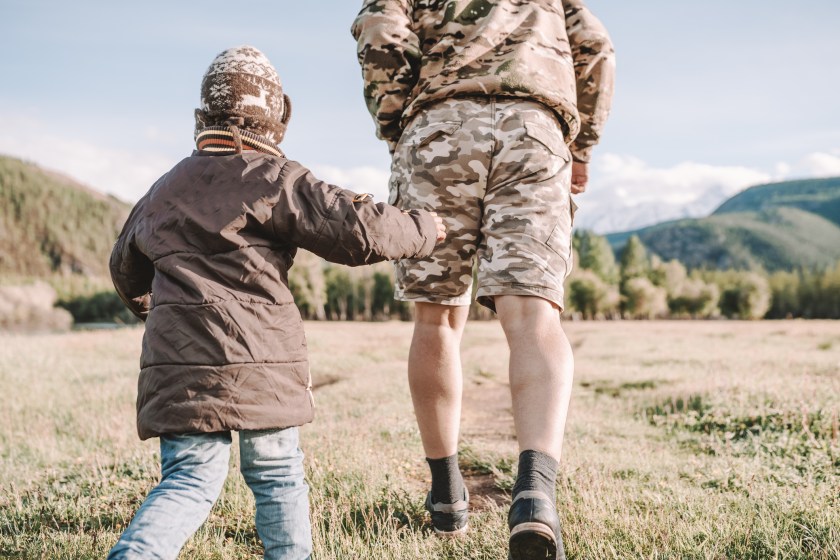 father and son walking in the countryside