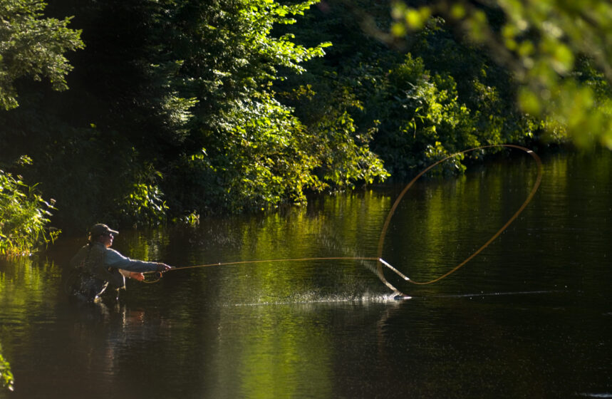 Fly fisherman working the West Arm of the Ausable river, Adirondacks NewYork