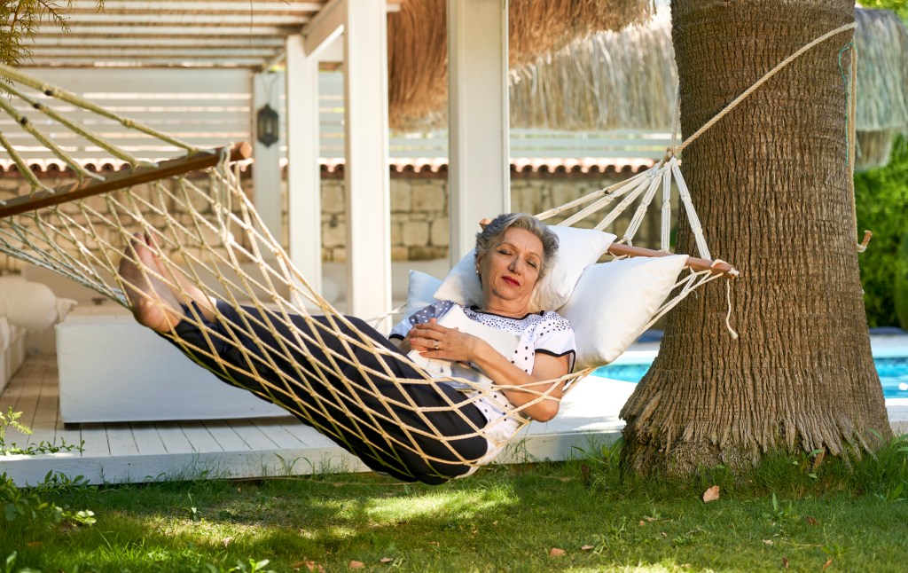 Woman lying in hammock