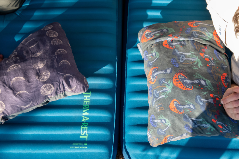 Two printed camping pillows from Thermarest on top of camping mattresses