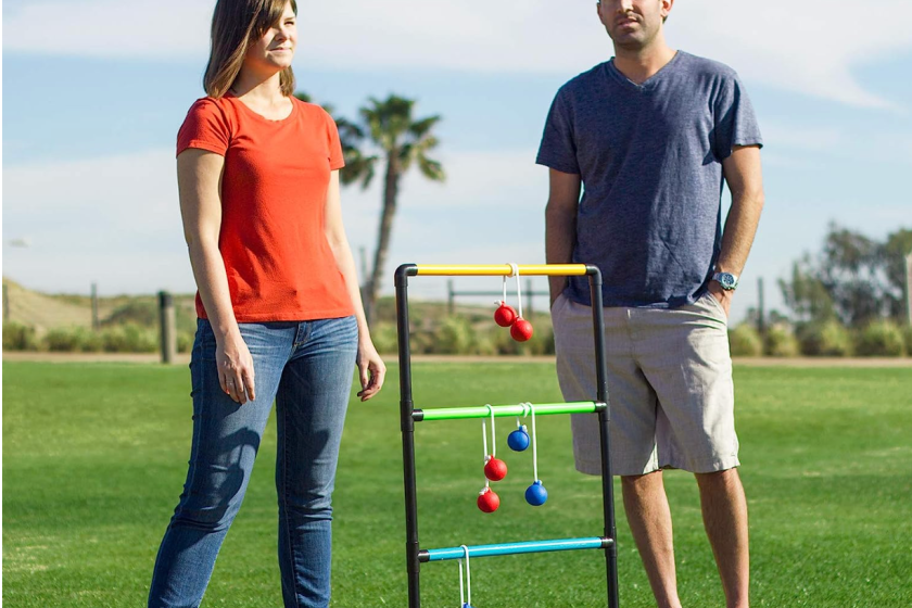 A couple playing ladder golf. 