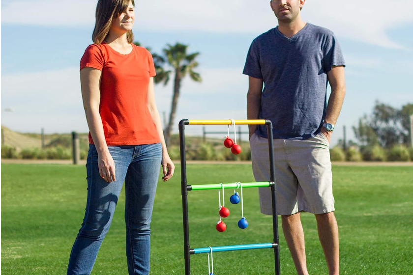 A couple playing ladder golf.