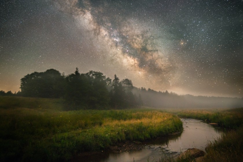 The night ushers in a haunting layer of fog in the distance as the Milky Way makes for a striking display above the country side surrounding Gandy Creek in West Virginia