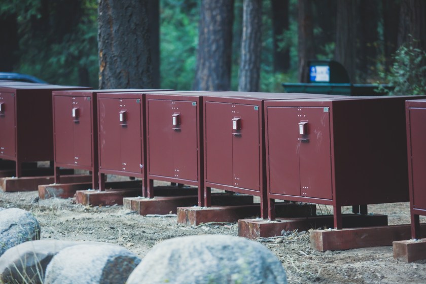 Row line of bear proof food metal storage lockers installed near camping campground in Yosemite National Park, California, United States"n