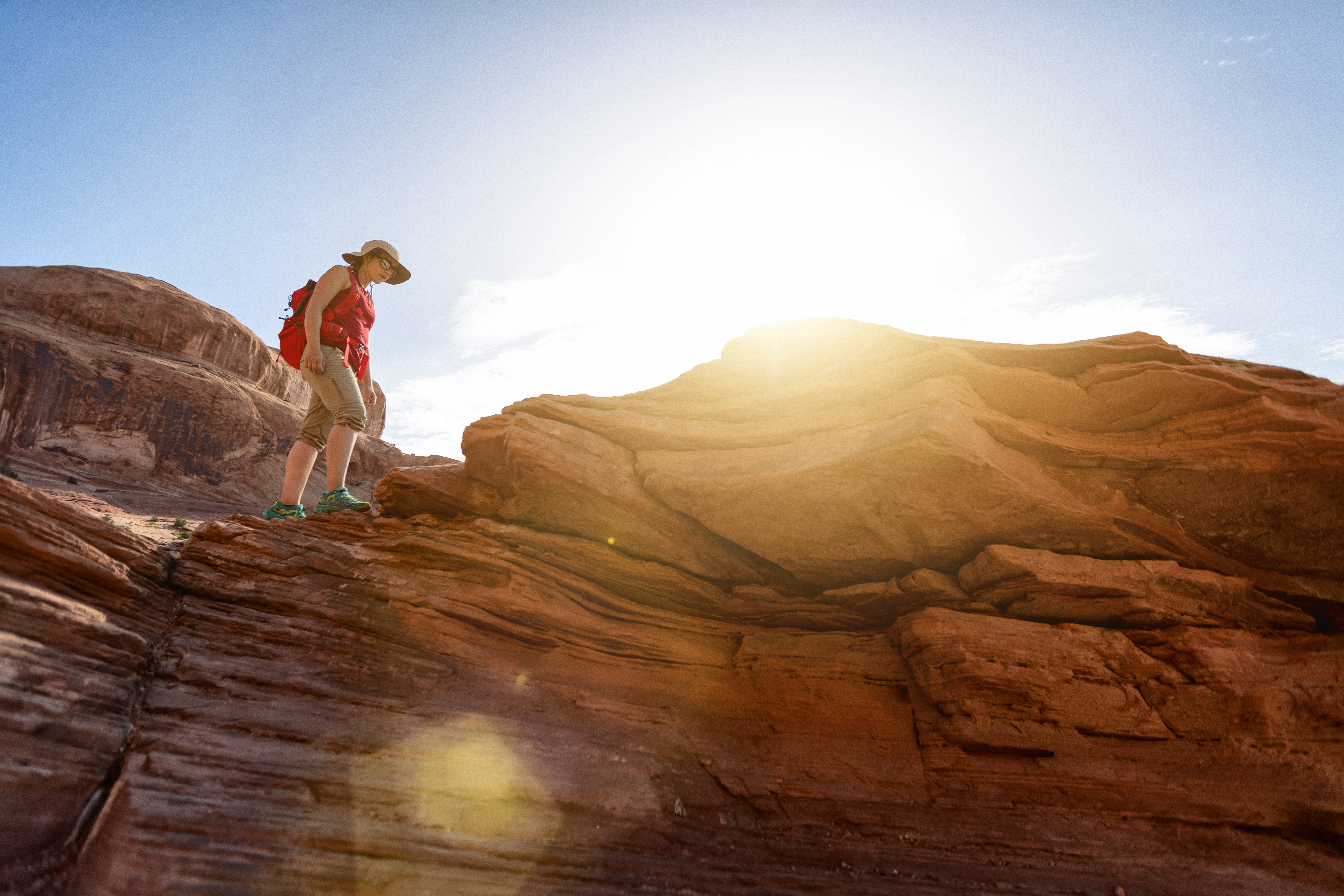 Under Corona arch: Woman hiking near Canyonlands, Moab