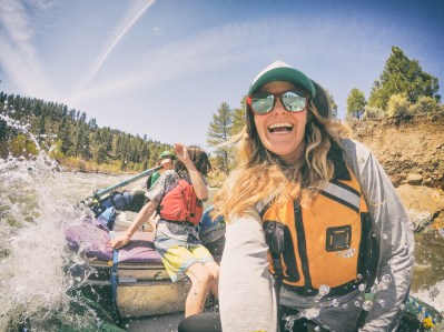 A couple take their children on a white water rafting camping trip in California.