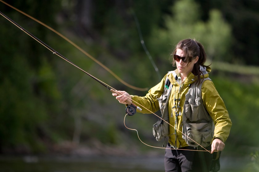 Woman fly fishing in British Columbia. 