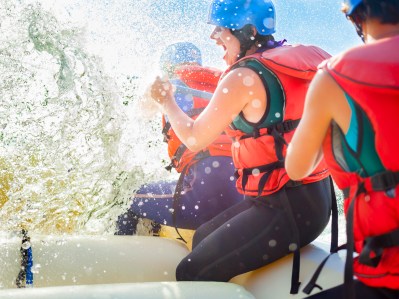Getting splashed while whitewater rafting