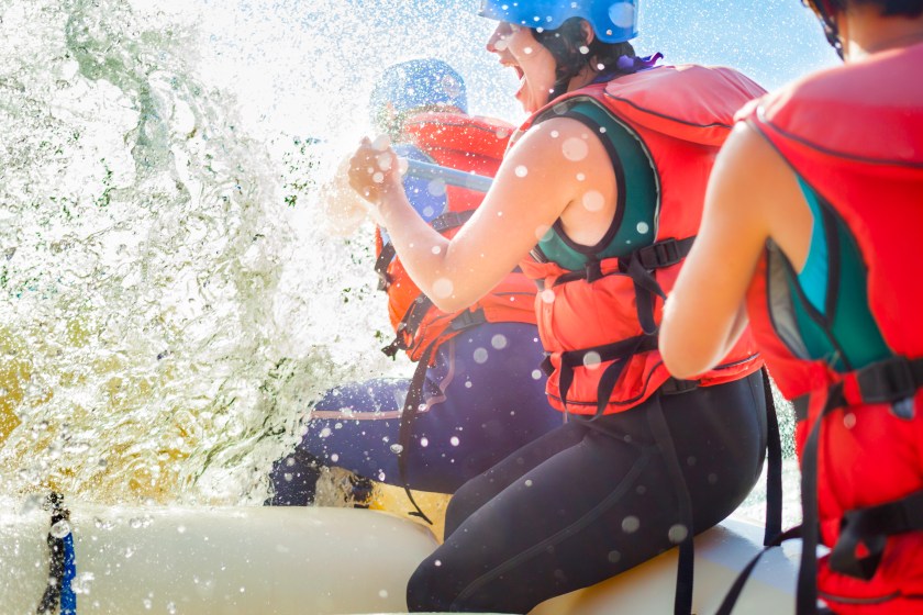 Getting splashed while whitewater rafting