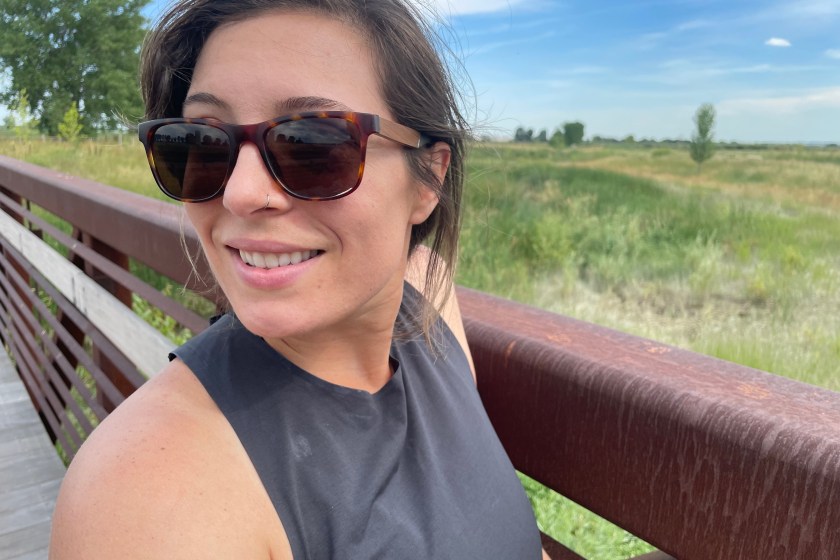 Author wearing CAMP sunglasses in front of an outdoor trail